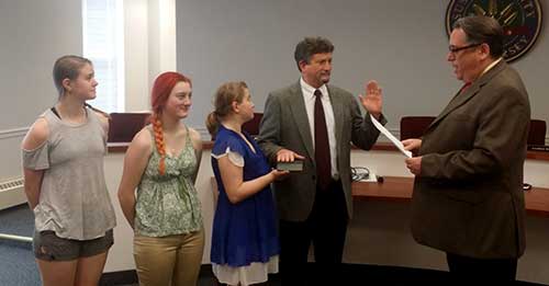 William J. Koppenaal, County Counsel John Williams, and William's daughters