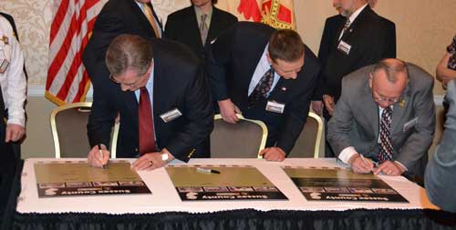 People signing Community Covenant